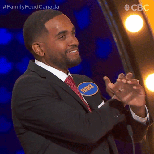 A Man In A Suit And Tie Is Applauding And Has A Name Tag That Says Patrick GIF