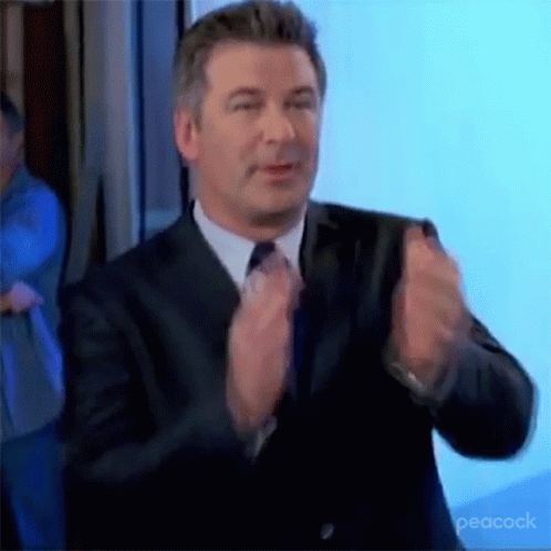 Man In Suit And Tie Applauding GIF
