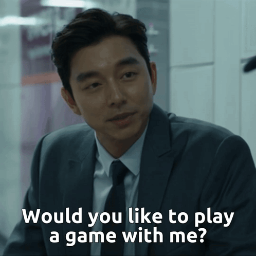 A Man In A Suit And Tie Is Asking If He Would Like To Play A Game With Him GIF