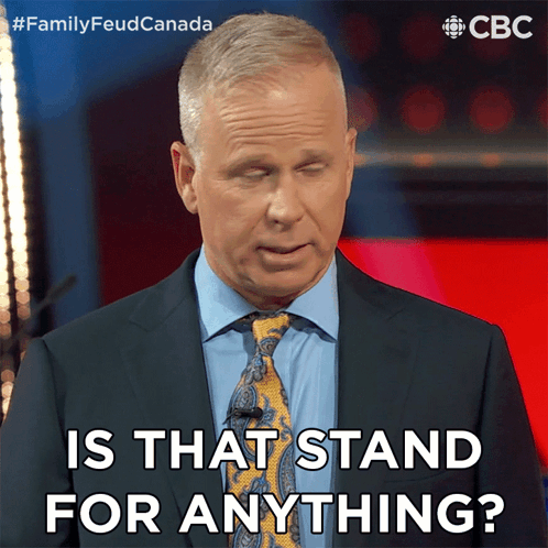 A Man In A Suit And Tie Is Asking If That Stand For Anything GIF