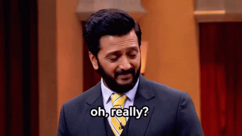 A Man In A Suit And Tie Is Asking " Oh Really " GIF