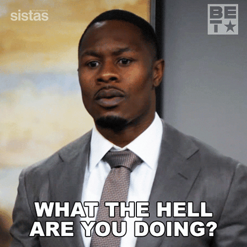A Man In A Suit And Tie Is Asking " What The Hell Are You Doing " GIF