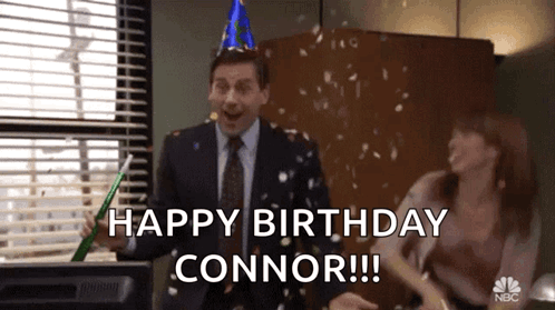 A Man In A Suit And Tie Is Celebrating His Birthday While A Woman Throws Confetti At Him . GIF