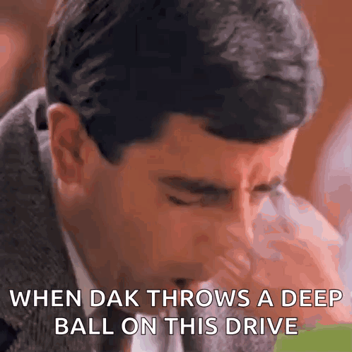 A Man In A Suit And Tie Is Coughing While Saying " When Dak Throws A Deep Ball On This Drive " GIF