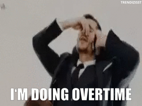 A Man In A Suit And Tie Is Covering His Nose With His Hand . GIF