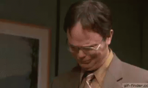 A Man In A Suit And Tie Is Crying While Saying Thank You . GIF