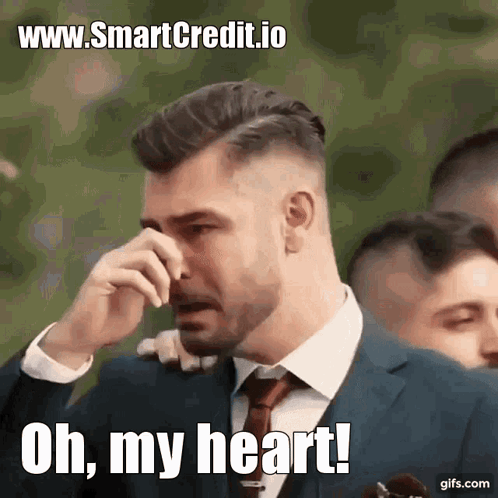 A Man In A Suit And Tie Is Crying With The Words Oh My Heart Written Below Him GIF