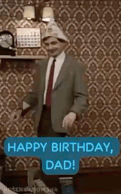 A Man In A Suit And Tie Is Dancing In A Living Room . GIF