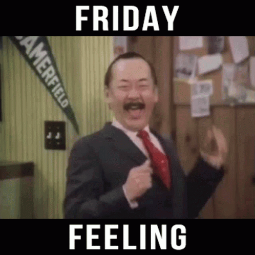 A Man In A Suit And Tie Is Dancing In A Room With The Words Friday Feeling . GIF