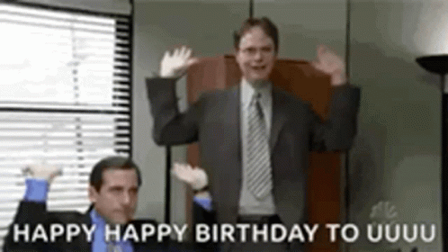 A Man In A Suit And Tie Is Dancing In Front Of A Window With The Words Happy Happy Birthday To Uuuu Written Below Him . GIF