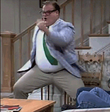 A Man In A Suit And Tie Is Dancing In Front Of Stairs GIF