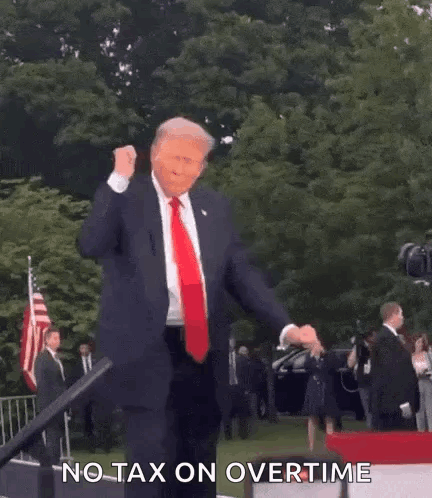 A Man In A Suit And Tie Is Dancing On A Stage . GIF