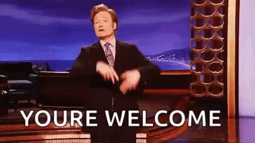 A Man In A Suit And Tie Is Dancing On A Stage With The Words `` Youre Welcome '' . GIF