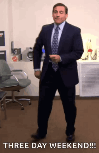 A Man In A Suit And Tie Is Dancing With The Words Three Day Weekend GIF