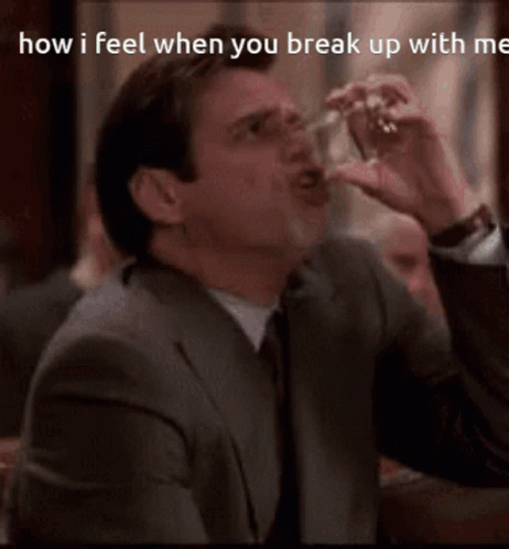 A Man In A Suit And Tie Is Drinking From A Glass With The Caption How I Feel When You Break Up With Me . GIF