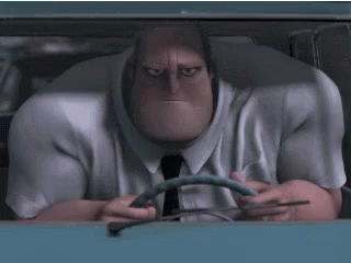 A Man In A Suit And Tie Is Driving A Car And Holding A Steering Wheel . GIF
