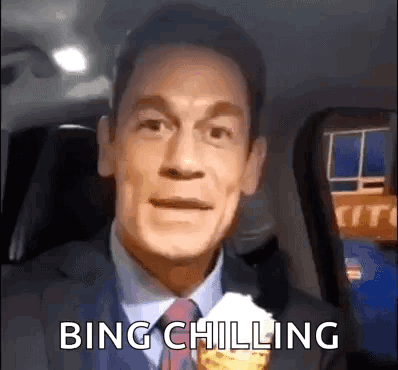 A Man In A Suit And Tie Is Eating An Ice Cream Cone And Saying Bing Chilling . GIF