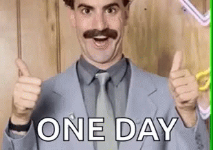 A Man In A Suit And Tie Is Giving A Thumbs Up And The Words `` One Day '' Behind Him . GIF