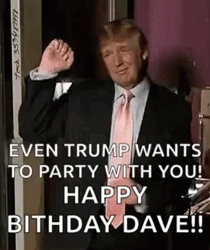 A Man In A Suit And Tie Is Giving A Thumbs Up . GIF