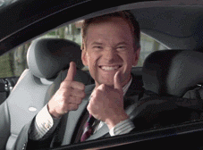 a man in a suit and tie is giving a thumbs up sign