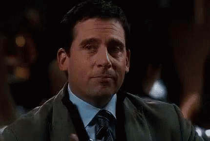 A Man In A Suit And Tie Is Holding A Glass Of Water And Saying De Nada . GIF