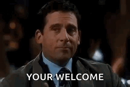 A Man In A Suit And Tie Is Holding A Glass Of Water And Toasting . GIF