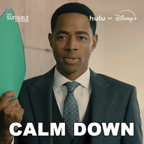 A Man In A Suit And Tie Is Holding A Green Folder And The Words Calm Down Are Above Him GIF