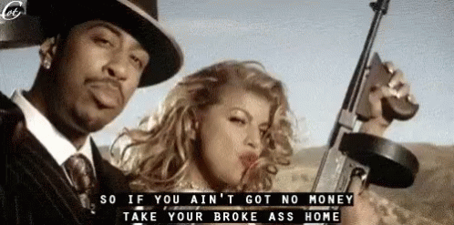 A Man In A Suit And Tie Is Holding A Gun Next To A Woman Who Is Blowing A Kiss . GIF