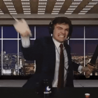 A Man In A Suit And Tie Is Holding A Knife And A Bottle Of Cozy GIF