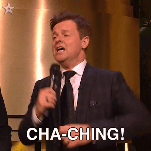 A Man In A Suit And Tie Is Holding A Microphone And Says Cha-Ching GIF