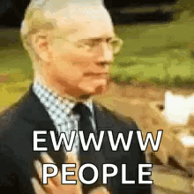 A Man In A Suit And Tie Is Holding A Microphone And Says Ewww People . GIF