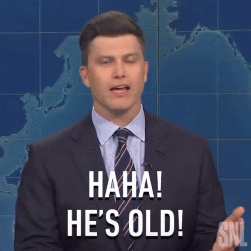 A Man In A Suit And Tie Is Holding A Pencil In His Hand And Saying He 'S Old . GIF
