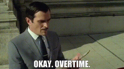 A Man In A Suit And Tie Is Holding A Piece Of Paper And Saying `` Okay , Overtime . '' . GIF