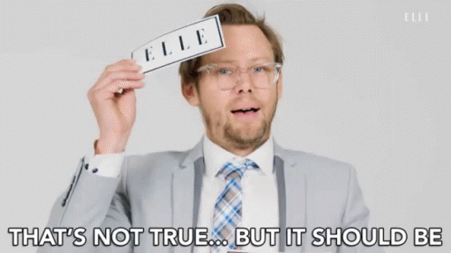 a man in a suit and tie is holding a piece of paper with the word elle on it