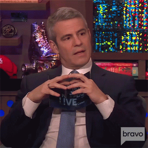 Man In Suit Holding Live Sign GIF
