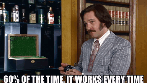 A Man In A Suit And Tie Is Holding A Watch With The Words " 60 % Of The Time It Works Every Time " Below Him GIF