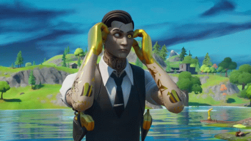 A Man In A Suit And Tie Is Holding His Hands To His Ears GIF
