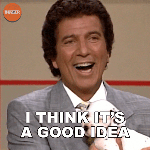 A Man In A Suit And Tie Is Laughing And Says I Think It 'S A Good Idea GIF