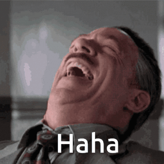 A Man In A Suit And Tie Is Laughing With The Word Haha Written Above Him GIF