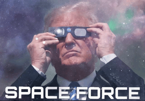 A Man In A Suit And Tie Is Looking Through A Pair Of Nasa Glasses With The Words Space Force Behind Him GIF