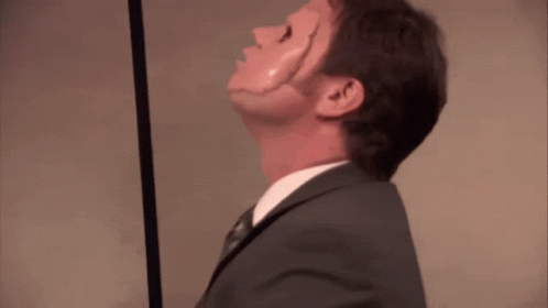 a man in a suit and tie is looking up