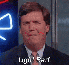 A Man In A Suit And Tie Is Making A Face And Saying Ugh ! Barf . GIF