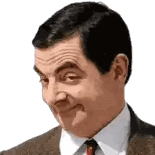 a man in a suit and tie is making a face .