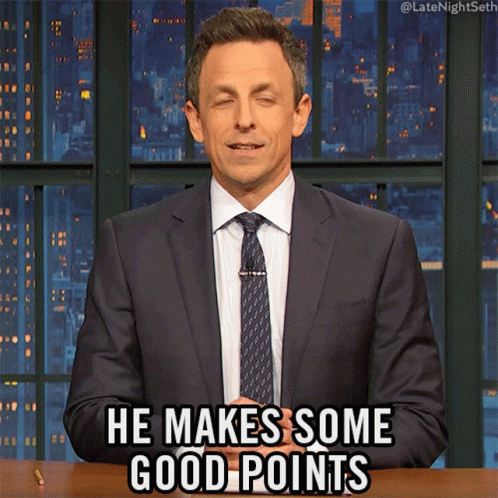 A Man In A Suit And Tie Is Making A Funny Face And Saying He Makes Some Good Points GIF
