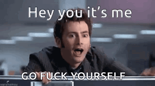a man in a suit and tie is making a funny face and saying `` hey you it 's me go fuck yourself `` .