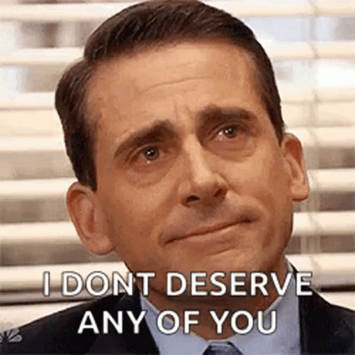 A Man In A Suit And Tie Is Making A Funny Face And Saying `` I Dont Deserve Any Of You '' . GIF
