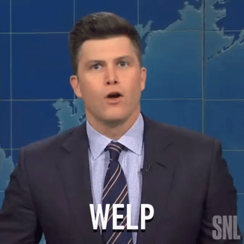 A Man In A Suit And Tie Is Making A Funny Face And Saying Welp . GIF