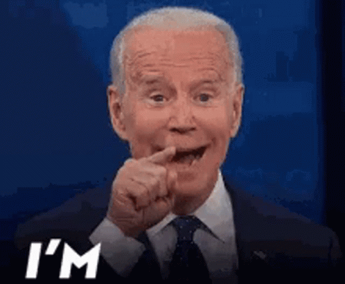 A Man In A Suit And Tie Is Making A Funny Face And Says I 'M GIF
