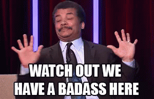 A Man In A Suit And Tie Is Making A Funny Face And Says Watch Out We Have A Badass Here . GIF