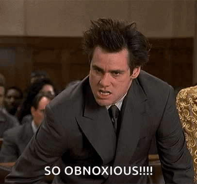 A Man In A Suit And Tie Is Making A Funny Face In Front Of A Crowd While Saying So Obnoxious . GIF